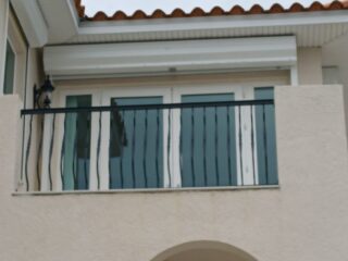 Custom fabrication and installation of home stair hand rail. Black powder coated aluminum. Shonefelt Welding and Fabrication in Clearwater Florida