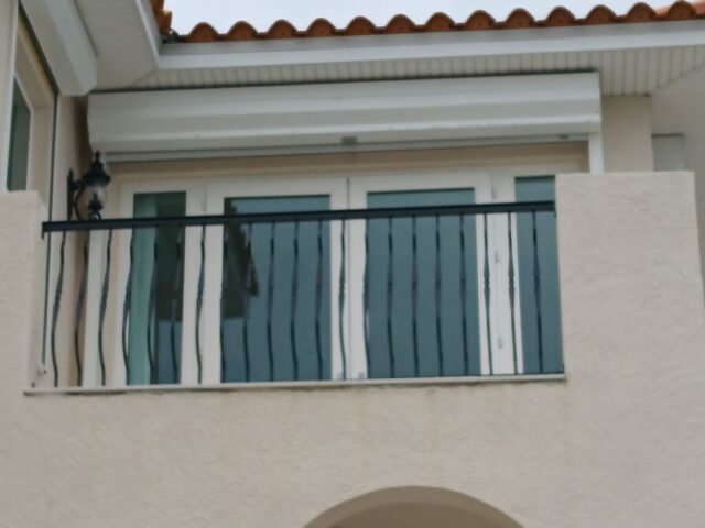 Custom fabrication and installation of home stair hand rail. Black powder coated aluminum. Shonefelt Welding and Fabrication in Clearwater Florida