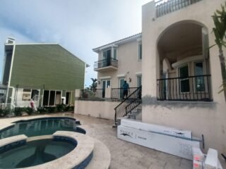 Custom fabrication and installation of home stair hand rail. Black powder coated aluminum. Shonefelt Welding and Fabrication in Clearwater Florida