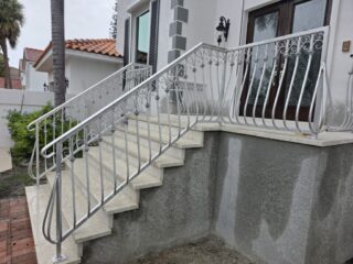 Custom fabrication and installation of home stair hand rail. Silver powder coated aluminum. Shonefelt Welding and Fabrication in Clearwater Florida