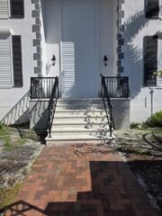 Custom fabrication and installation of home stair hand rail. Black powder coated aluminum.
