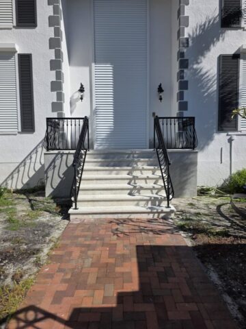 Custom fabrication and installation of home stair hand rail. Black powder coated aluminum.