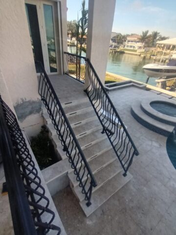Custom fabrication and installation of home stair hand rail. Black powder coated aluminum. Shonefelt Welding and Fabrication in Clearwater Florida